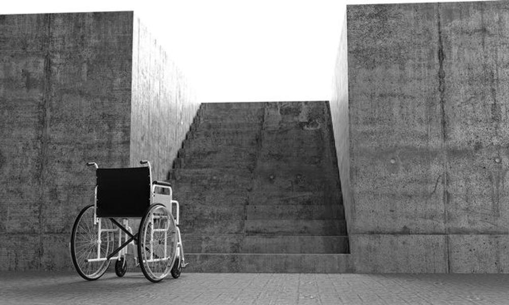 Wheelchair in front an architectural barriers